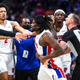 Teammates, coaches, and officials attempt to de-escalate the situation between Isaiah Stewart and LeBron James in Detroit.